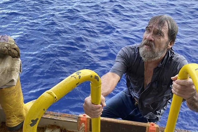 Stuart Bee, 62, who went missing Friday, Nov. 27, 2020, is rescued by the crew aboard the U.S. Coast Guard container ship Angeles.