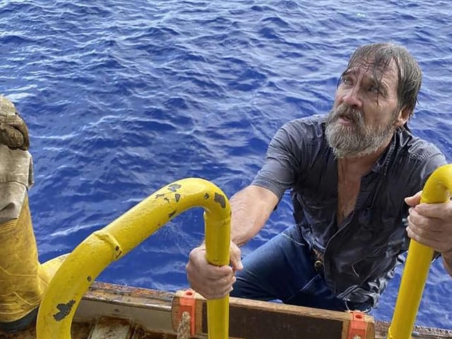 Stuart Bee, 62, who went missing Friday, Nov. 27, 2020, is rescued by the crew aboard the U.S. Coast Guard container ship Angeles.