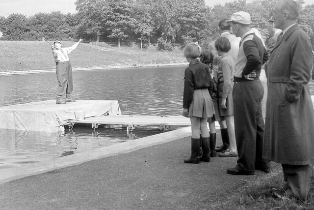 Spectators enjoy a fly fishing competition at Inverleith Pond in September 1954.