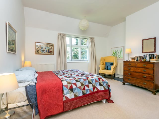 There are six good-sized bedrooms throughout the property in total, including this master room which offers plenty of storage space and has a modern feel thanks to the neutral decor.