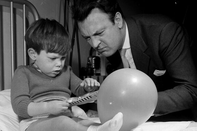 Actor Donald Sinden visits Edinburgh's Royal Hospital for Sick Children to deliver presents to the kids in December 1962.