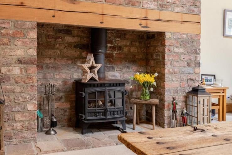 The pictured wood-burning stove comes with the Houghton property.