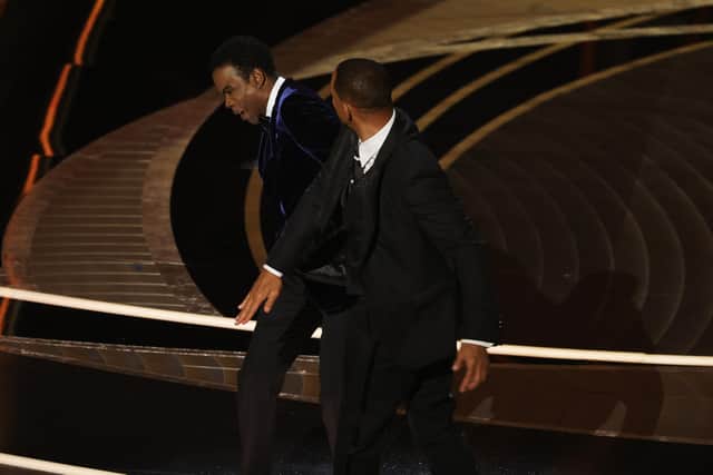 Will Smith appears to slap Chris Rock onstage during the 94th Annual Academy Awards at Dolby Theatre on March 27, 2022 in Hollywood, California. (Photo by Neilson Barnard/Getty Images)