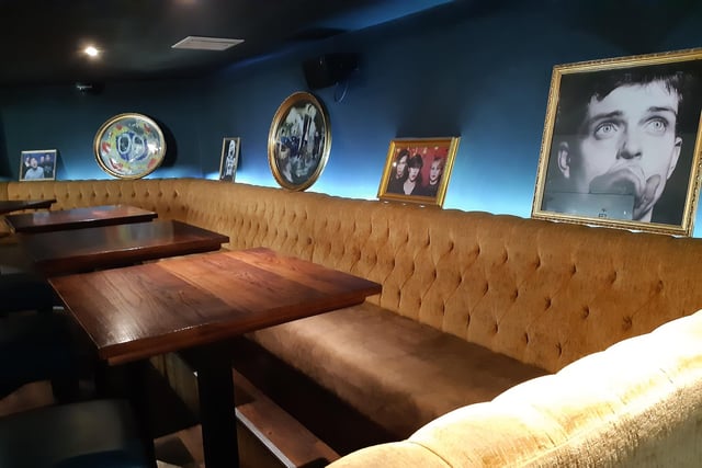 Seating and tables inside the Indie Go bar Sheffield, on Eldon Street, formerly home to the Devonshire Cat