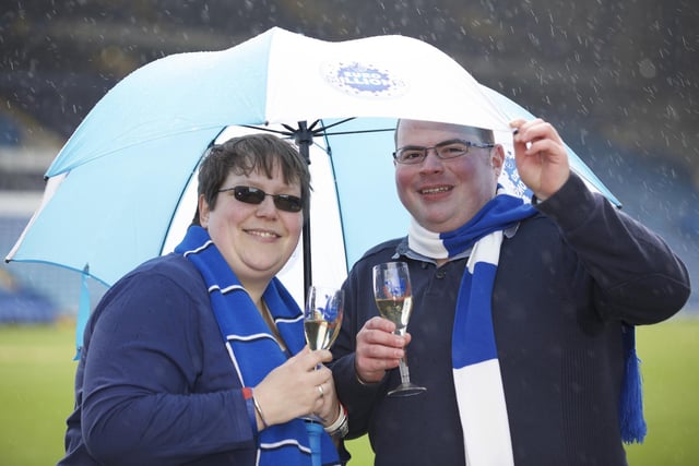 Andrew Perkins (25) of Sheffield celebrates at Hillsborough stadium after winning £1,150,000 in the EuroMillions Mega draw on Friday March 27, 2015. He is pictured with girlfriend Christina Maher.