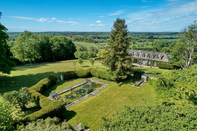 The property sits in 72 acres of land that include immaculate gardens and grounds, a walled garden with pavilion, a water feature, paddocks, woodland and even a helicopter hangar