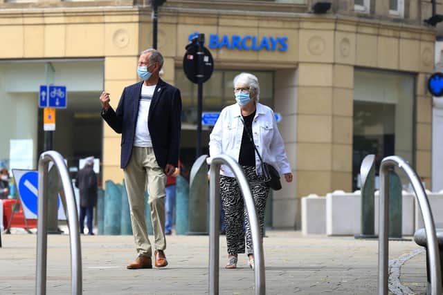 It is now compulsory for people to wear masks when going into shops. Picture: Chris Etchells