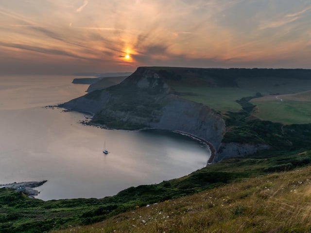 Chapman’s Pool sits is backed by high cliffs and offers superb views. Down in the cove there’s a couple of fisherman’s huts and a slipway (Photo: Shutterstock)