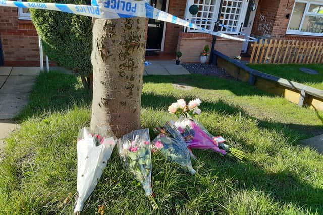 Flowers left at the suspected murder scene at Edenthorpe Dell, Owlthorpe, Sheffield, today