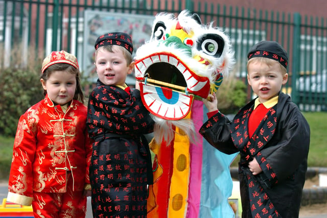 Celebrating the Chinese New Year at Seaham Harbour Nursery in 2011 were four year olds Millie Thompson, George Teasdale and Oliver Wood.
