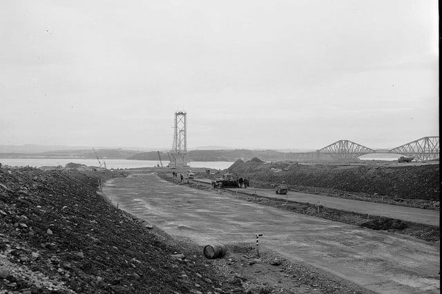 The construction of the Forth Road Bridge approach road, near Dalmeny, with the Forth Bridge in the background, in October 1961