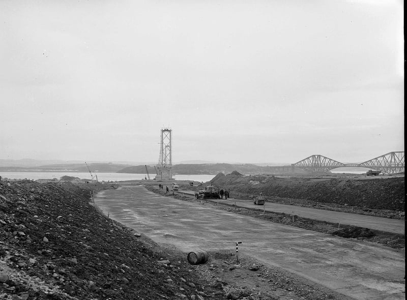 The construction of the Forth Road Bridge approach road, near Dalmeny, with the Forth Bridge in the background, in October 1961