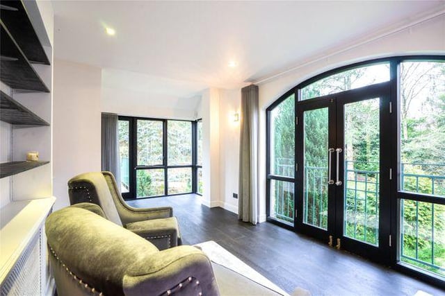 The ground floor also features a family playroom with a Juliet balcony and elevated views over the private gardens