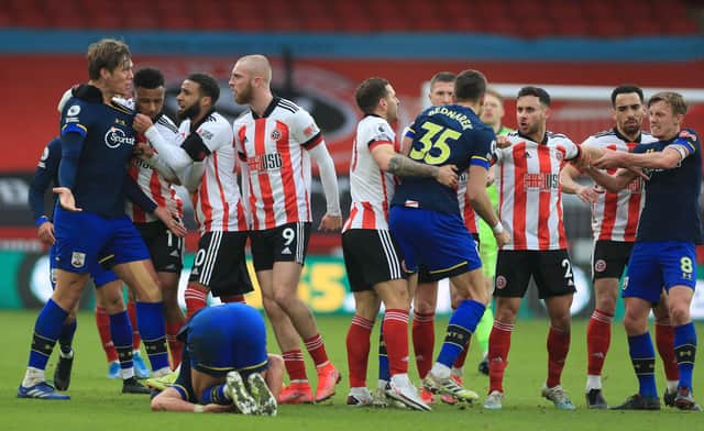 Players including Southampton's Jannik Vestergaard and Sheffield United's striker Oli McBurnieget involved in a melee  (Photo by MIKE EGERTON/POOL/AFP via Getty Images)