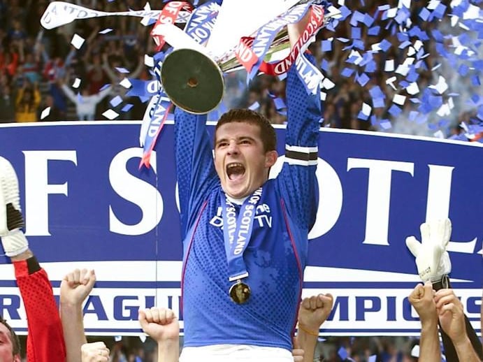 Lifted the SPL trophy for the first time as Rangers captain in 2003 and it would not be the last.