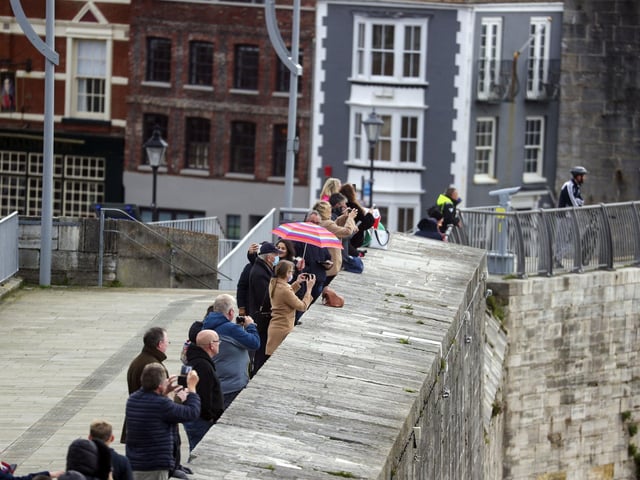 Friends, family and wellwishers watch HMS Dragon return