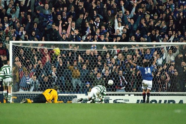 19/11/95 -  Tosh McKinlay knocked in Rangers' third, much to Ally McCoist's delight and sent the home side 3-2 ahead, but Celtic pulled them back again to draw 3-3