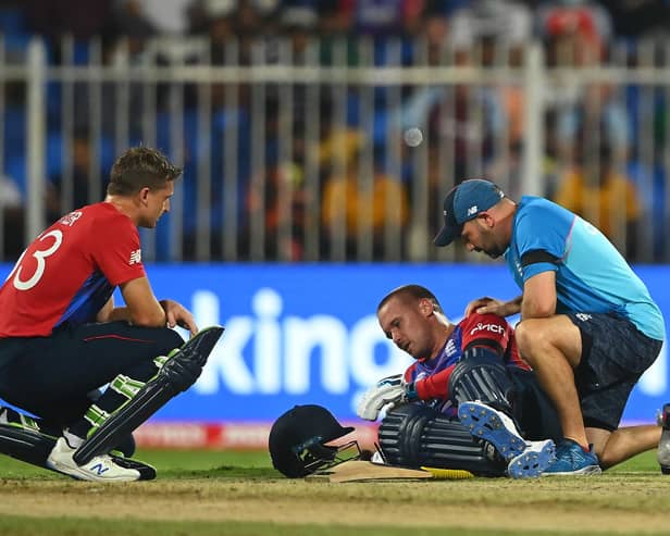 Jason Roy of England receives medical attention during the ICC Men's T20 World Cup match between England and SA at Sharjah Cricket Stadium. (Photo by Alex Davidson/Getty Images)