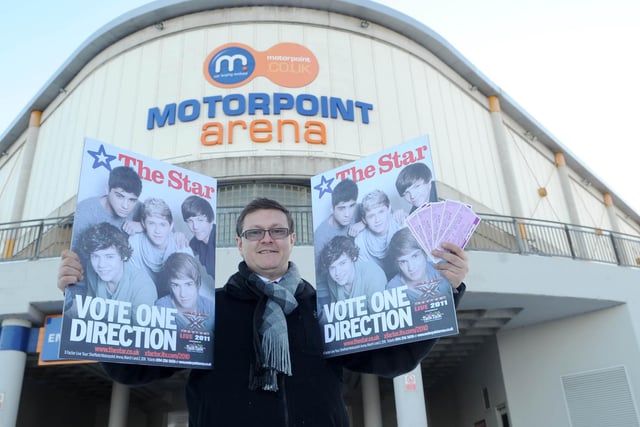 Doncaster lad Louis Tomlinson's dad Mark picking up his tickets at Sheffield Motorpoint Arena when Louis' band One Direction were still X Factor finalists and playing the venue in March 2010