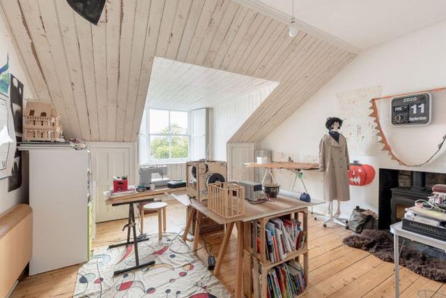 Those floors, wall and that wood burner are just idyllic an make this room a peaceful hideaway.