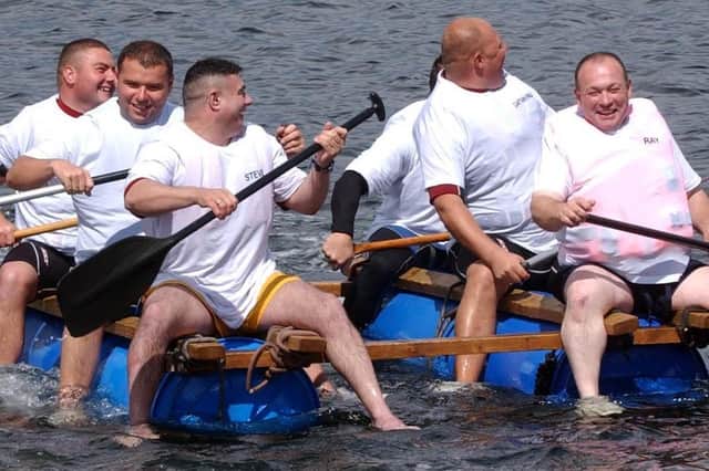 This raft race team looks like it is having a fantastic time. Can you spot anyone you know?
