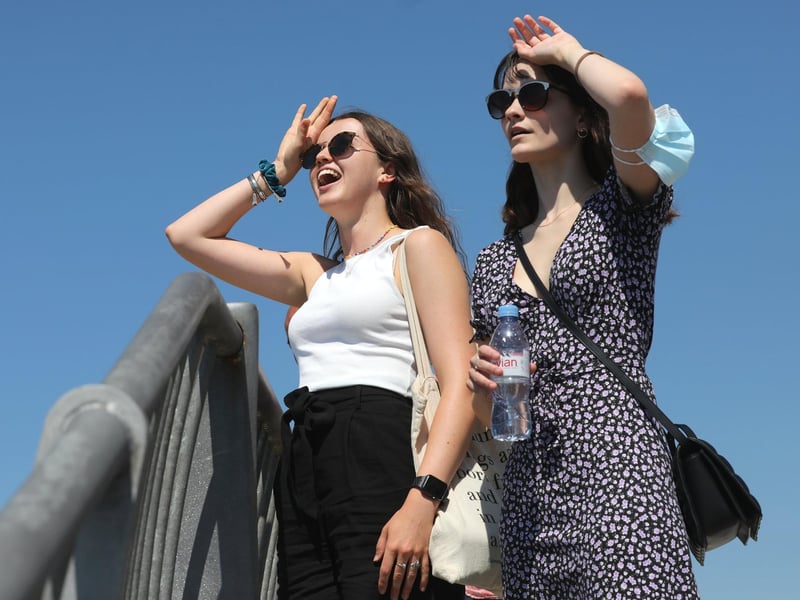Two walkers look to sea during the weekend's hot weather in Old Portsmouth.
