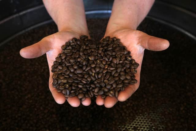 Pictured is Frazer Habershon with the freshly ground coffee beans. Picture: Chris Etchells
