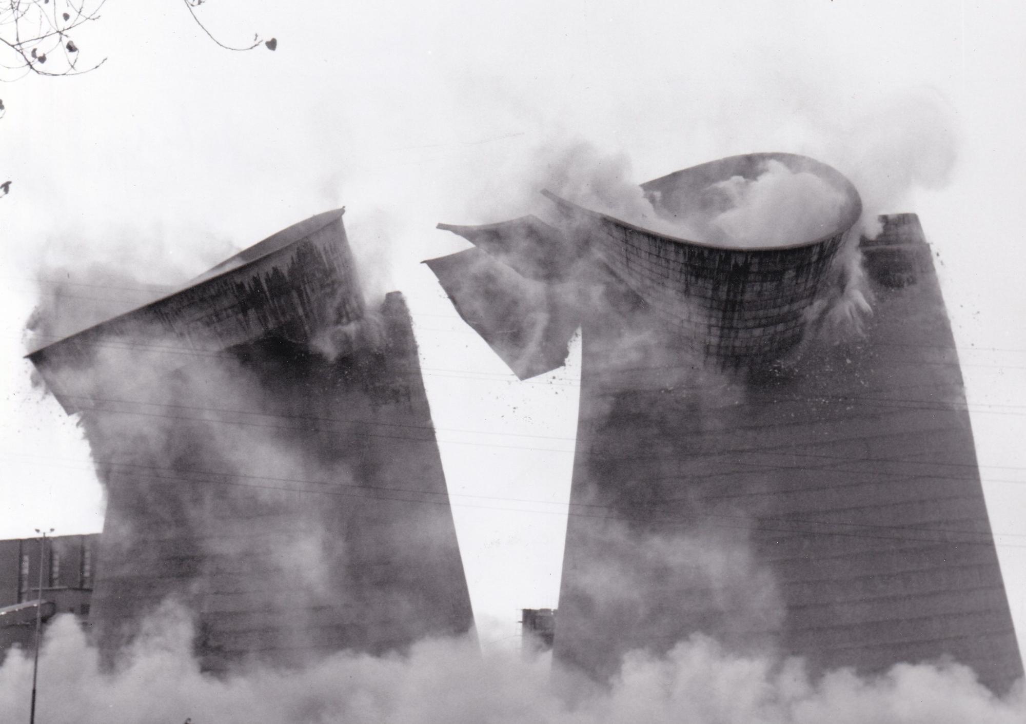 The 300ft cooling towers at Skelton Grange 'A' power station in Leeds,  each weighing 4,000 tonnes, are sent crashing down by a controlled explosion in November 1989