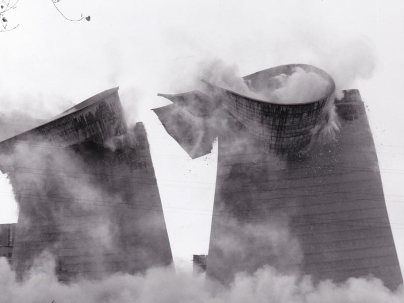 The 300ft cooling towers at Skelton Grange 'A' power station in Leeds, each weighing 4,000 tonnes, are sent crashing down by a controlled explosion in November 1989