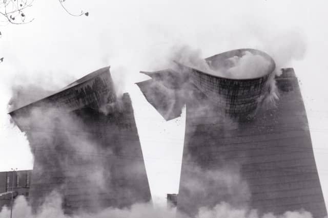 The 300ft cooling towers at Skelton Grange 'A' power station in Leeds, each weighing 4,000 tonnes, are sent crashing down by a controlled explosion in November 1989