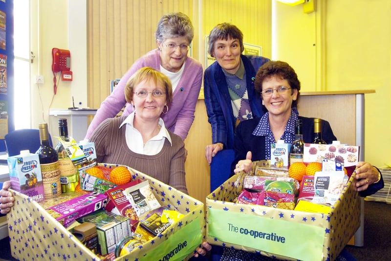 Fairtrade Hamper presentations. Wilma Gibson and Rowan Burn-Murdoch  (both Doncaster Fair Trade Committee) present hampers to Patricia Wade (front left) from Wheatley and Carol Lambe from Barnby Dun