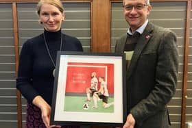 Councillor Alison Teal and Nick Partridge, Head of Libraries, receive Black Lives Matter artwork