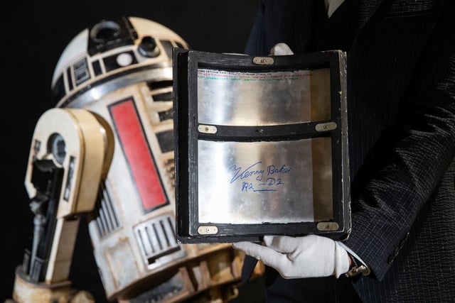 Panel signed by Kenny Baker from a Light-up remote-control R2-S8 droid from the 2018 film 'Star Wars: Solo: A Star Wars Story' (estimate £40,000-£60,000).