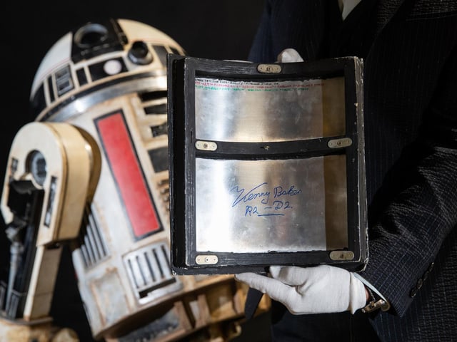 Panel signed by Kenny Baker from a Light-up remote-control R2-S8 droid from the 2018 film 'Star Wars: Solo: A Star Wars Story' (estimate £40,000-£60,000).