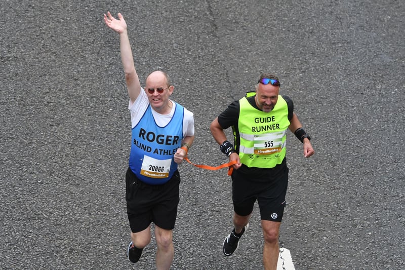 Blind athlete Roger on the Great North Run route with his guide runner.