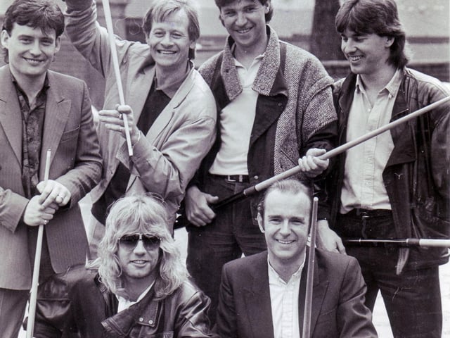 Alex Higgins, Tony Knowles, Jimmy White and Kirk Stevens pictured with Status Quo members Francis Rossi and Rick Parfitt at the launch of the record "The Wanderer" by the snooker stars,  April 23, 1986