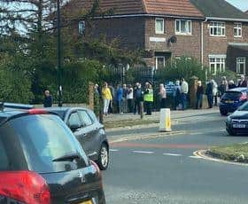 People were seen standing in a long queue outside Manor Park Medical Centre on Thursday afternoon.