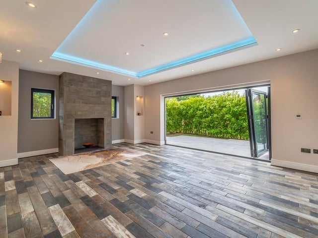 The living room, which also leads outside. Like all rooms on the ground floor and first floor, it benefits from underfloor heating.