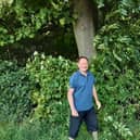 Emeritus Professor Ian Rotherham says that Sheffield City Council needs to challenge the government over its actions to combat deadly tree diseases such as ash dieback. He is pictured in front of an ash tree in Graves Park