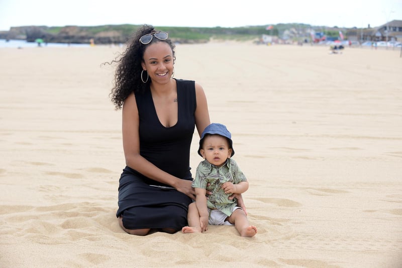 Jamie Okoth with son Kairo Norouzi at Sandhaven Beach.