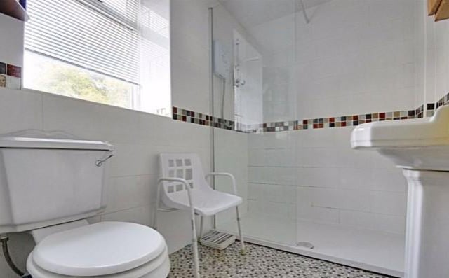 The bathroom has recently been refitted with a white suite, this includes the walk in shower, lower level WC and wash basin.