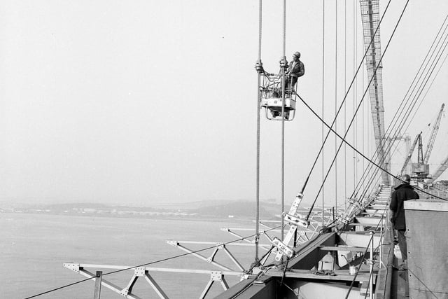 Painting the main suspension steel ropes of the Forth Road Bridge in September 1963.