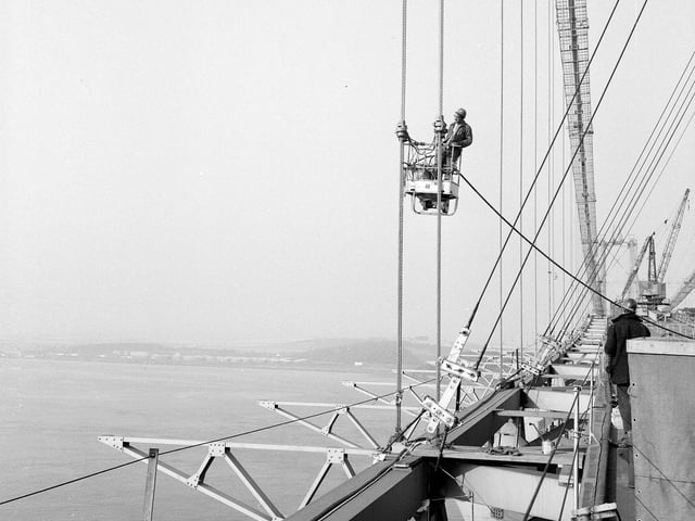 Painting the main suspension steel ropes of the Forth Road Bridge in September 1963.