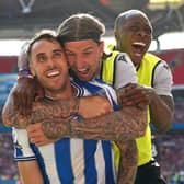 Sheffield Wednesday's Lee Gregory (left), Aden Flint and Dennis Adeniran celebrate their side's first goal of the game, scored by team-mate Josh Windass (not pictured) during the Sky Bet League One play-off final at Wembley Stadium, London. Picture date: Monday May 29, 2023. PA Photo. See PA story SOCCER Final. Photo credit should read: Nick Potts/PA Wire.RESTRICTIONS: EDITORIAL USE ONLY No use with unauthorised audio, video, data, fixture lists, club/league logos or "live" services. Online in-match use limited to 120 images, no video emulation. No use in betting, games or single club/league/player publications.