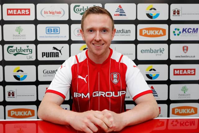 Shane Ferguson has joined Rotherham United on a two-year deal following his release from Millwall
