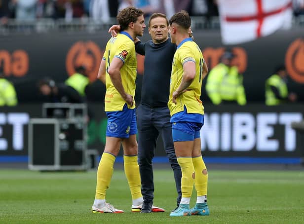 Neal Ardley consoles Callum Howe and Sheffield United loanee Harry Boyes of Solihull Moors after their side's defeat during the Vanarama National League Final match against Grimsby Town at London Stadium (Steve Bardens/Getty Images)