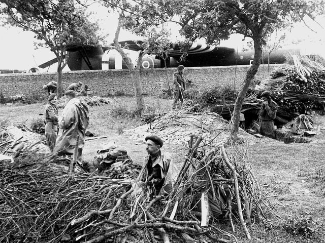 Airborn troops dig in alongside their Airspeed Horsa gliders close to where they landed at midnight 6/6/1944, prior to the attack to capture the soon to be famous Pegasus bridge over the Caen canal.
IWM pic B5051