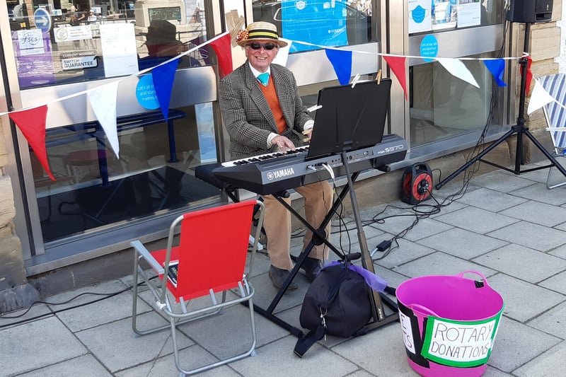 A busker raising funds for Seahouses Rotary.