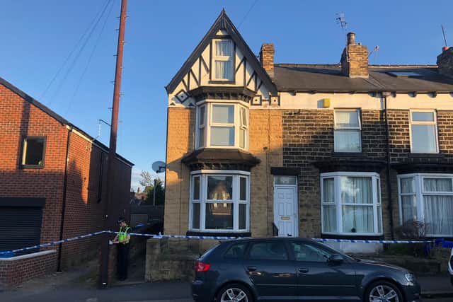 Police officers and the forensic team were in and around the terrace house on Rockley Road near Hillsborough Stadium.