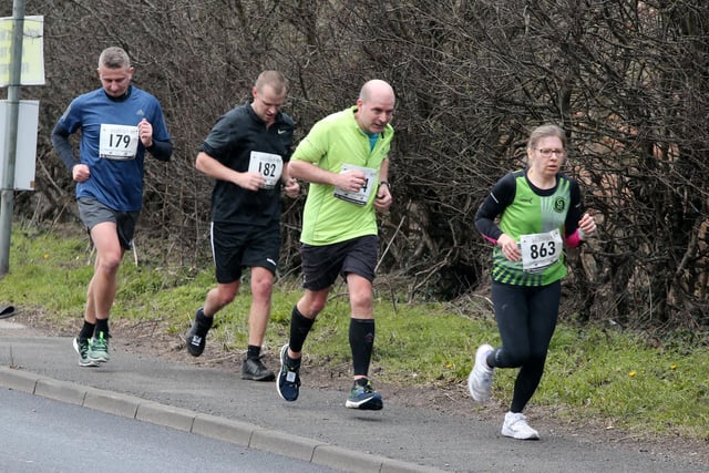 Runners climb the hill on the straight mile into Retford.